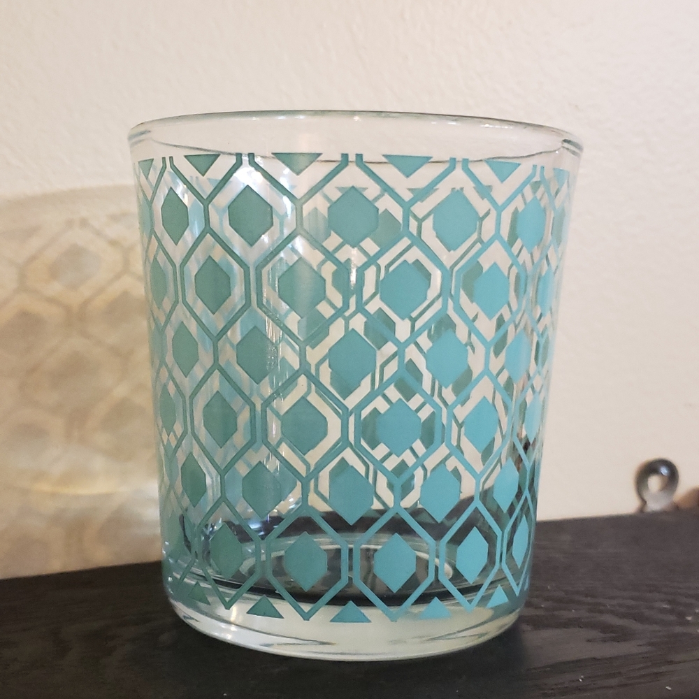 New Glass jar with teal geometric pattern.